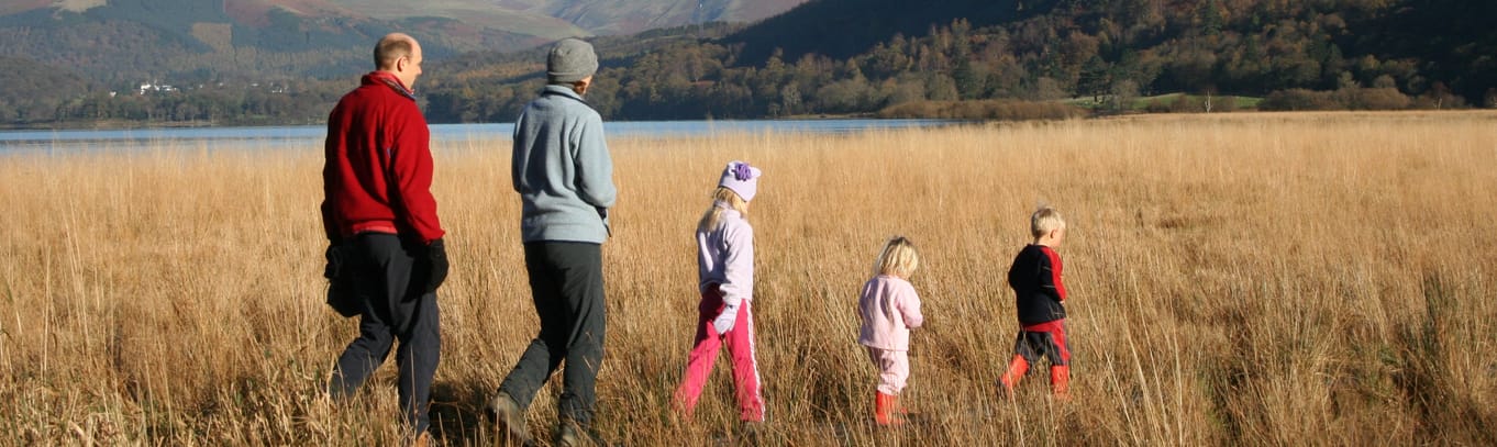 Family walking by Derwentwater