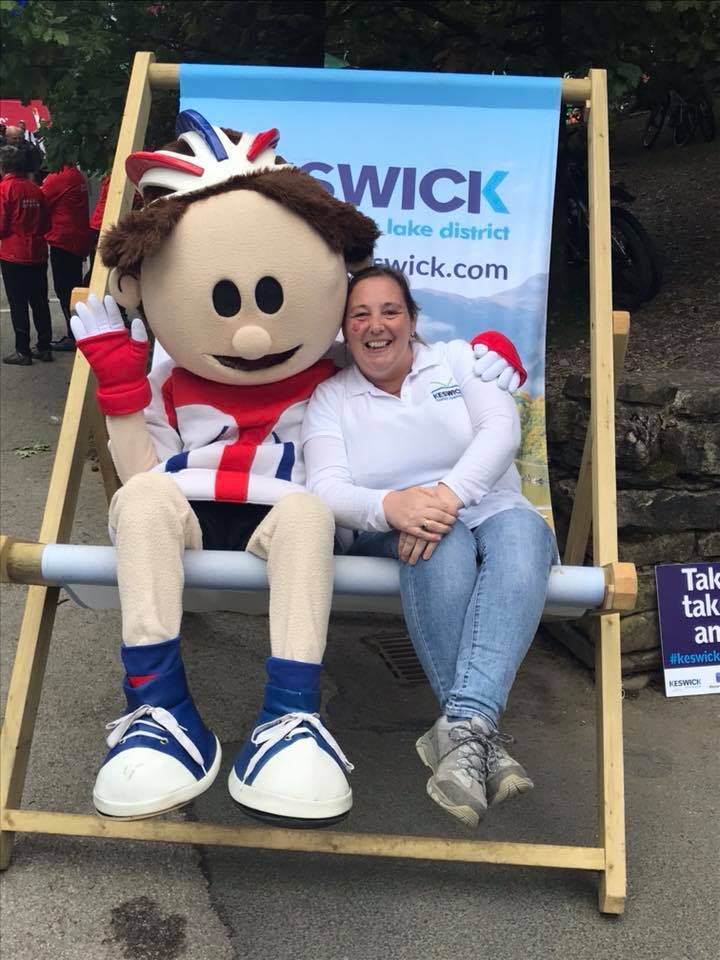 Vanessa Metcalfe, Keswick Tourism Association (R) with tour of britain mascot TOBI