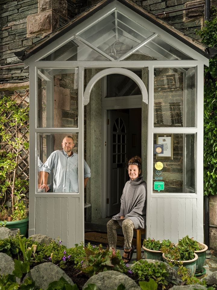 Owners of Allerdale House in the front porch