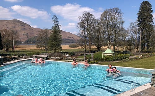 Some of the first spa goers enjoying sunshine, blue skies and amazing views from the outdoor swimming pool.