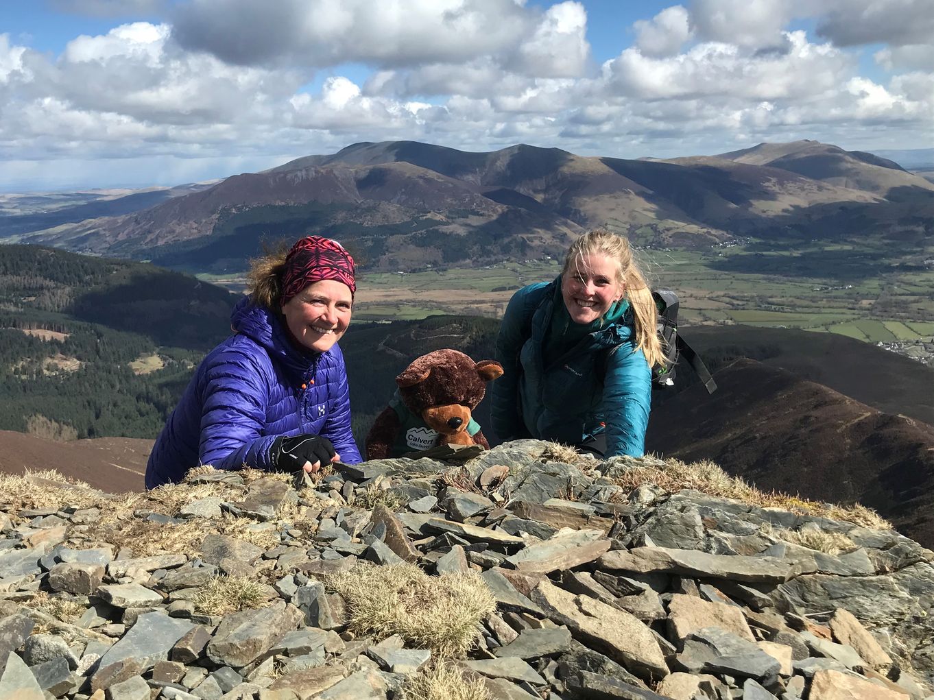 Helen Hunt, (who has planned, set up and will lead the Rotary 5 Peaks Challenge), together with Rosie Cumella , a member of the Calvert Lakes Fund raising staff, and also in the challenge team, on a training exercise with Calvert Bear 