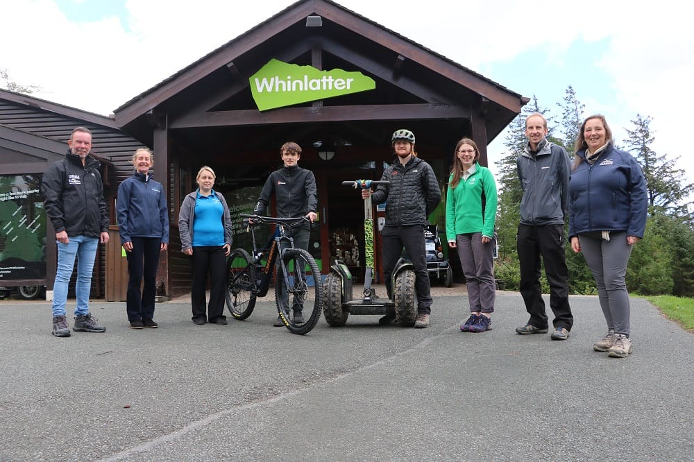 Cumbria Residents Week participating businesses and partners standing in front of the Whinlatter visitor centre