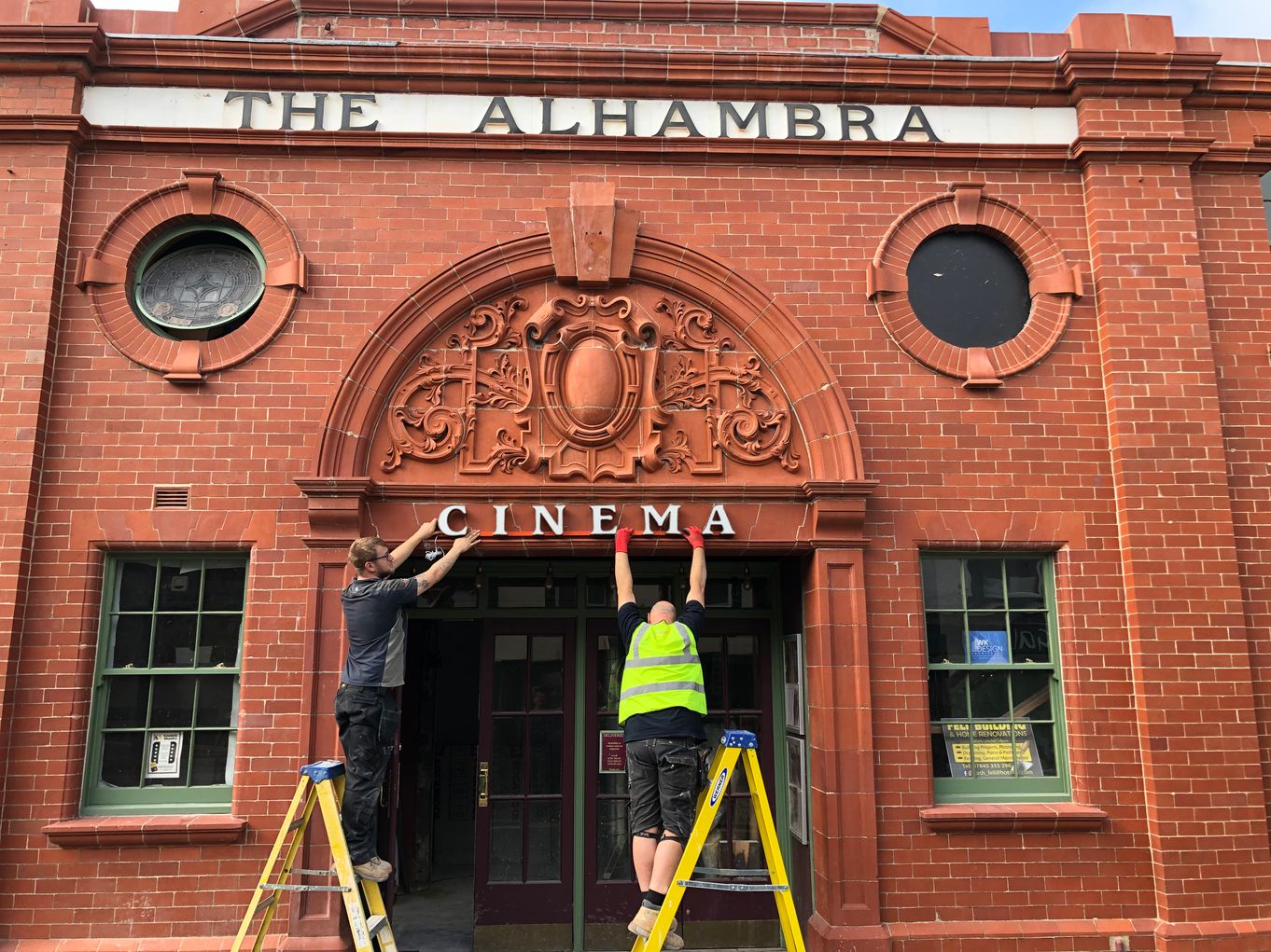 Cinema signage being reinstated on th front of the building