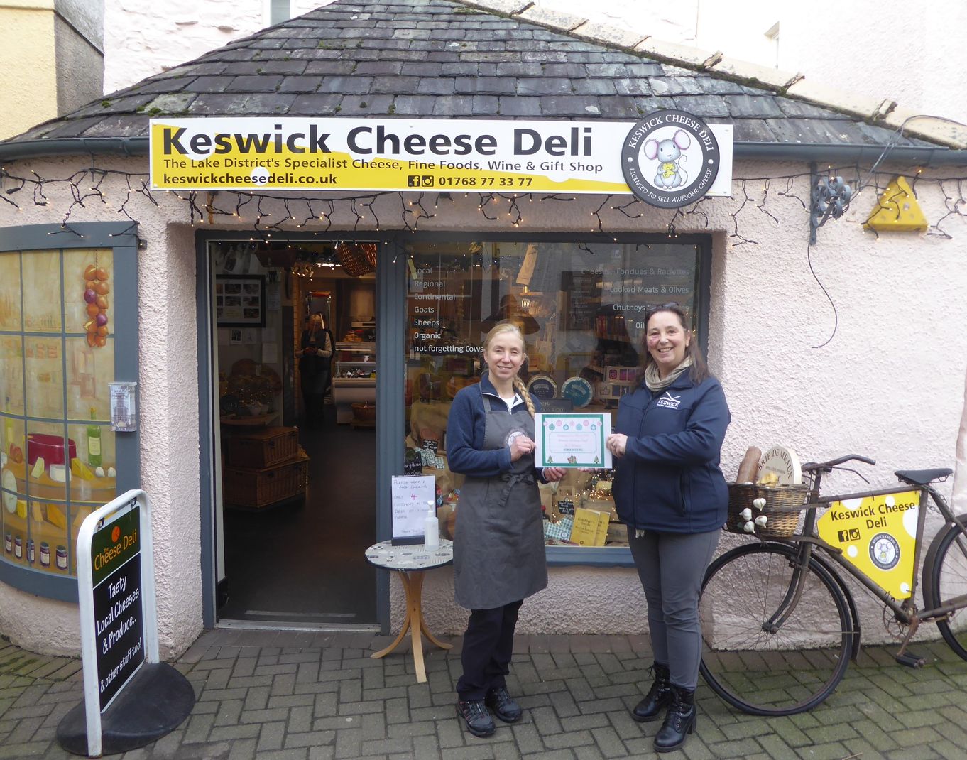 Hayley Peacock, owner of Keswick Cheese Deli being presented with the winners certificate by Vanessa Metcalfe, KTA Tourism Manager