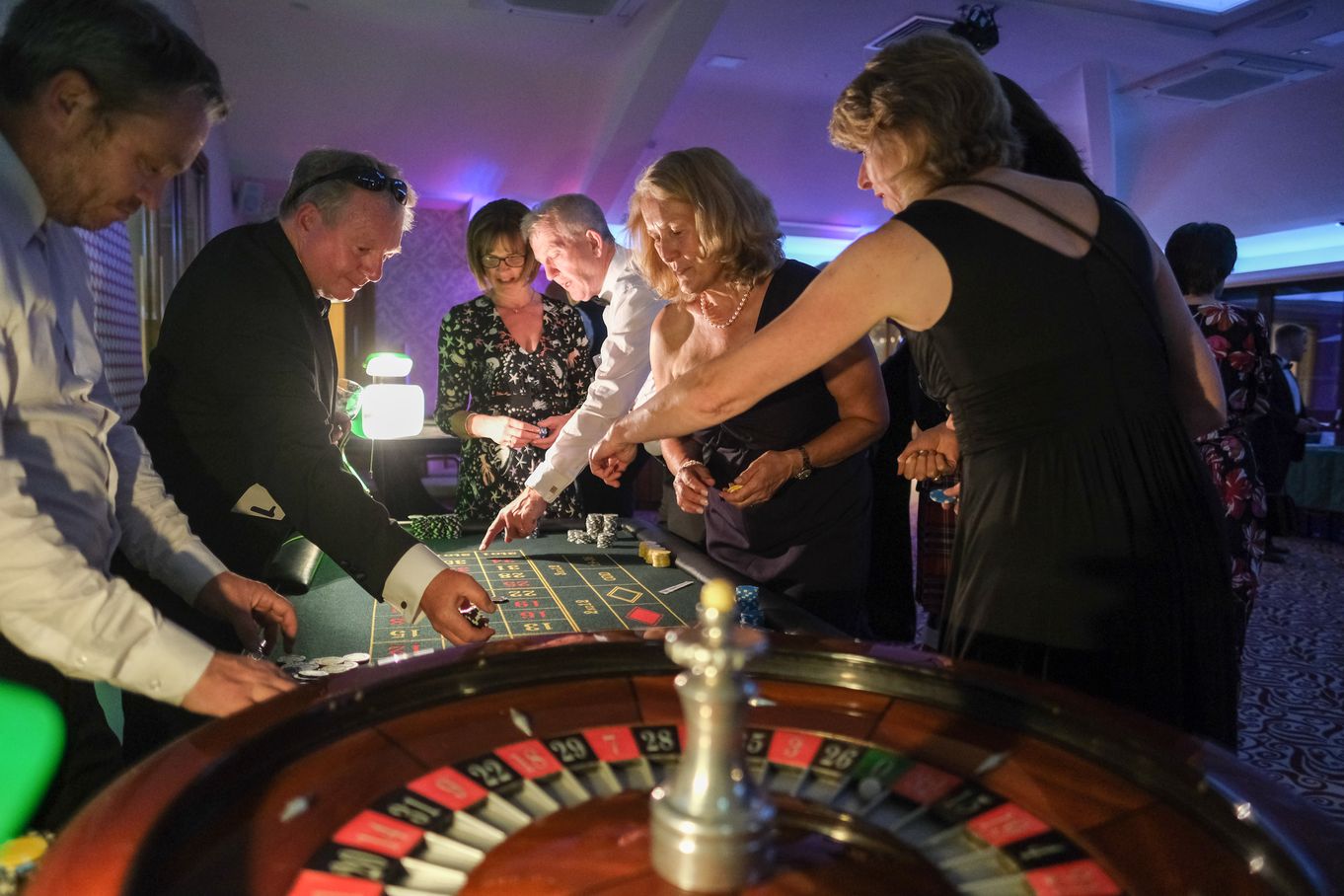 People playing at the roulette table of the Calvert Summer Ball Casino
