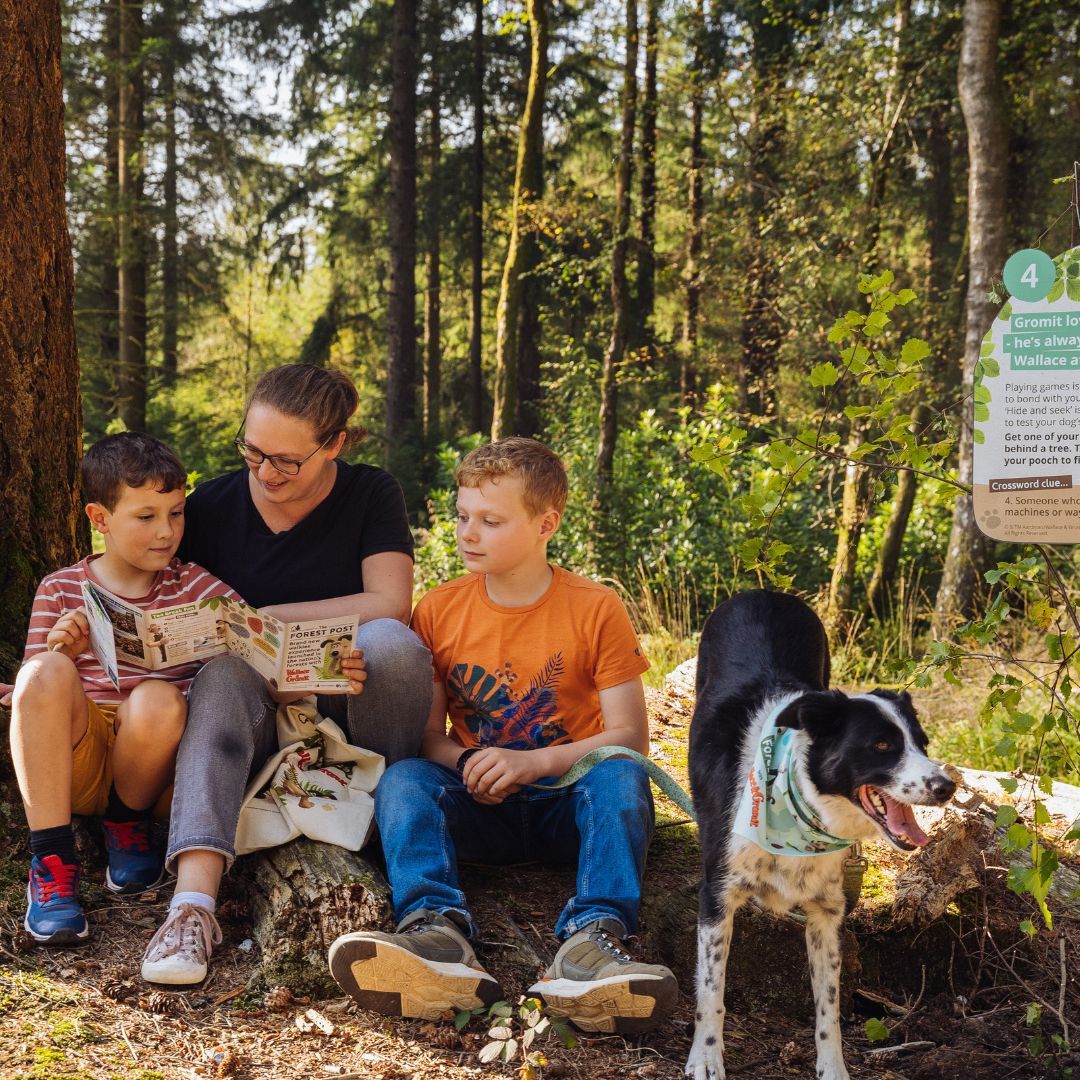 family completing activity book at trail sign.jpg